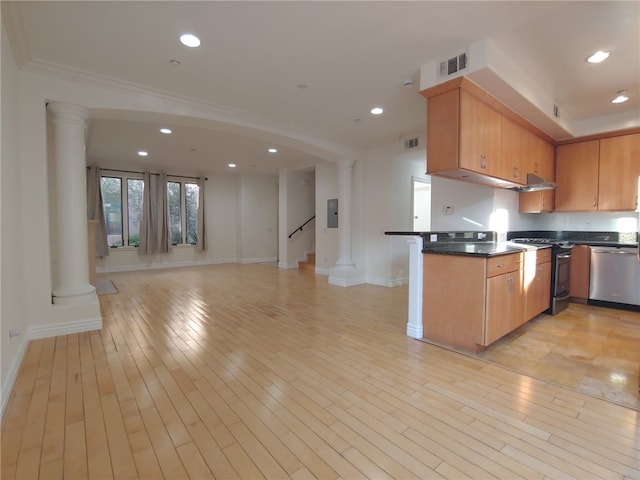 kitchen featuring light hardwood / wood-style floors, kitchen peninsula, stainless steel appliances, and electric panel