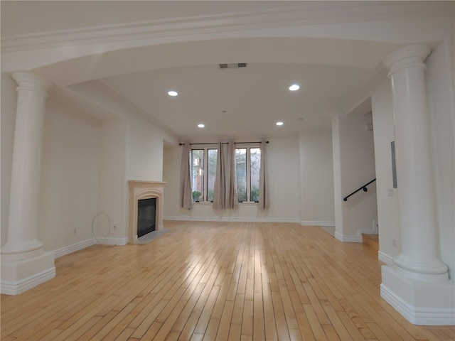 unfurnished living room featuring light hardwood / wood-style floors