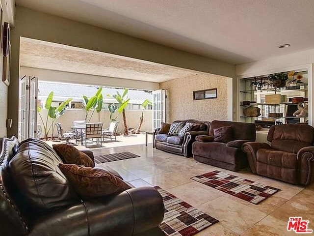 living room with a textured ceiling