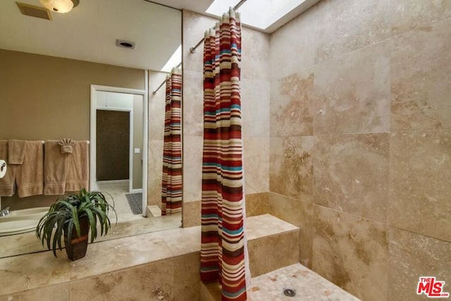 bathroom with tile patterned floors