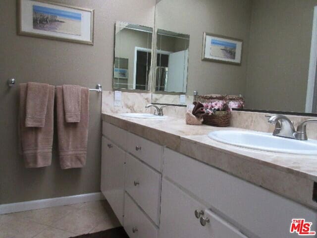 bathroom featuring tile patterned flooring and vanity