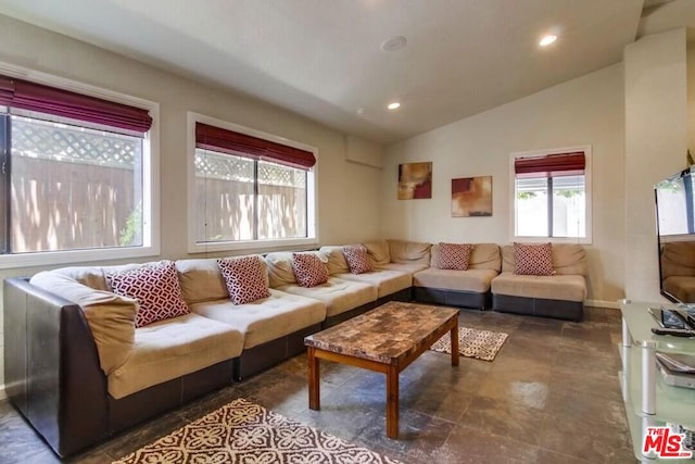 living room featuring vaulted ceiling