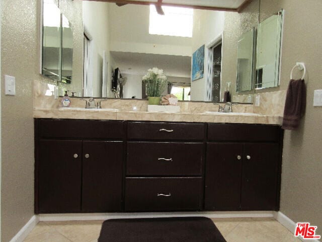 bathroom with tile patterned flooring and vanity