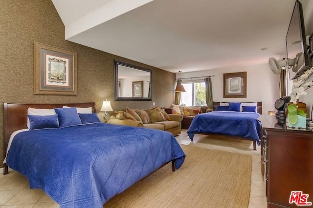 tiled bedroom featuring lofted ceiling