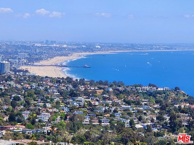 bird's eye view with a water view and a view of the beach