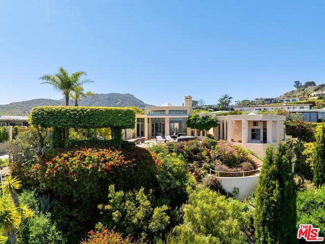 rear view of house with a mountain view