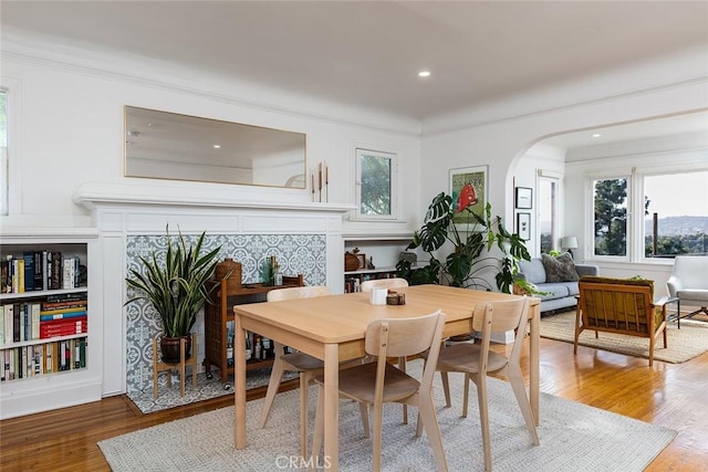 dining room featuring hardwood / wood-style flooring and ornamental molding