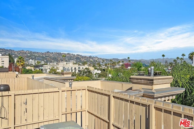 balcony featuring a mountain view