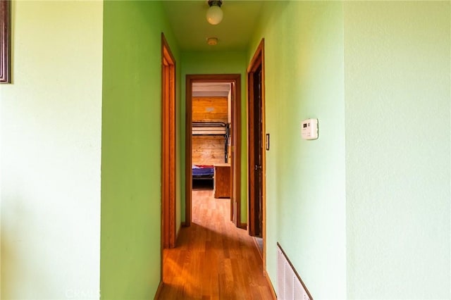 hallway with light wood-type flooring