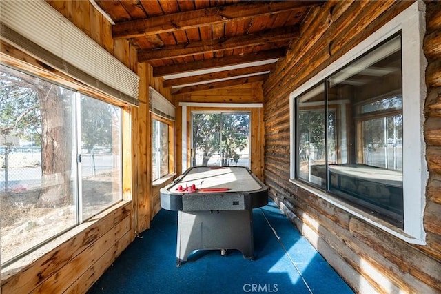 unfurnished sunroom featuring wood ceiling and lofted ceiling with beams