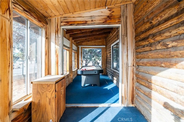 recreation room with dark colored carpet, lofted ceiling, and wood ceiling