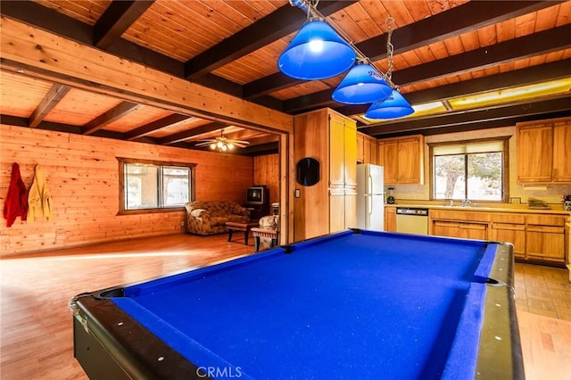 rec room with beam ceiling, billiards, light hardwood / wood-style floors, wooden walls, and wood ceiling