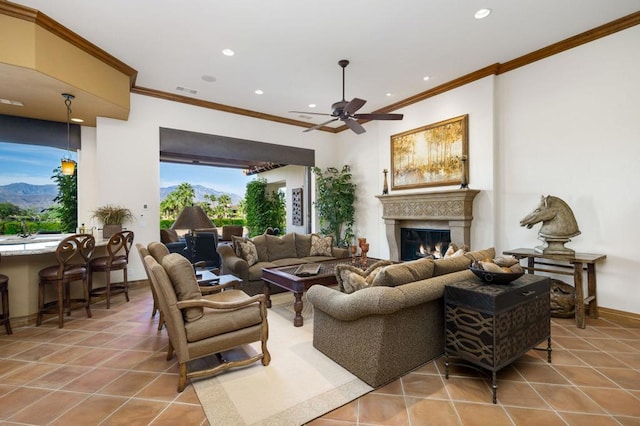 living room featuring ceiling fan, light tile patterned flooring, and crown molding