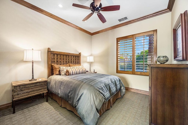 carpeted bedroom featuring ceiling fan and crown molding