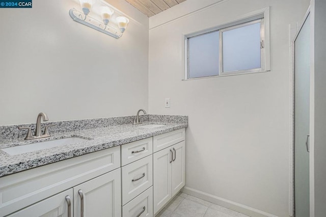 bathroom with vanity and tile patterned floors