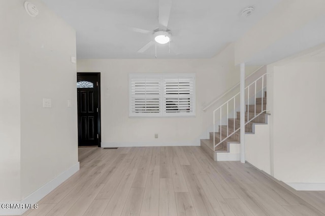 empty room featuring ceiling fan and light wood-type flooring