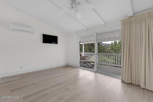 empty room featuring a wall mounted air conditioner, light wood-type flooring, and vaulted ceiling with beams