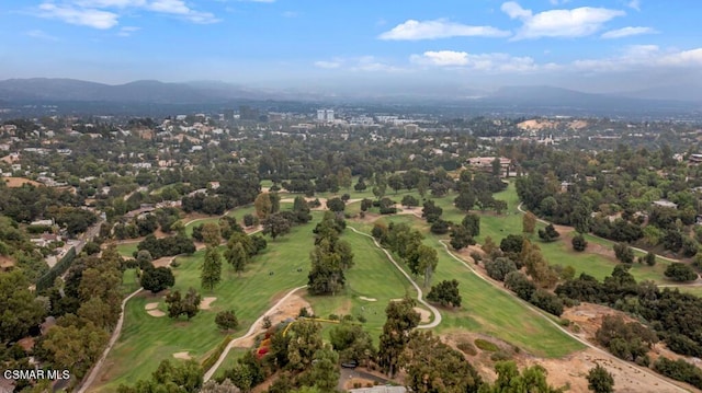 birds eye view of property with a mountain view