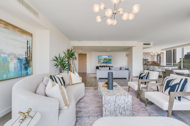 living room featuring an inviting chandelier and hardwood / wood-style floors