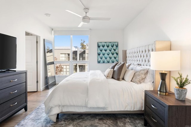 bedroom featuring ceiling fan and hardwood / wood-style flooring