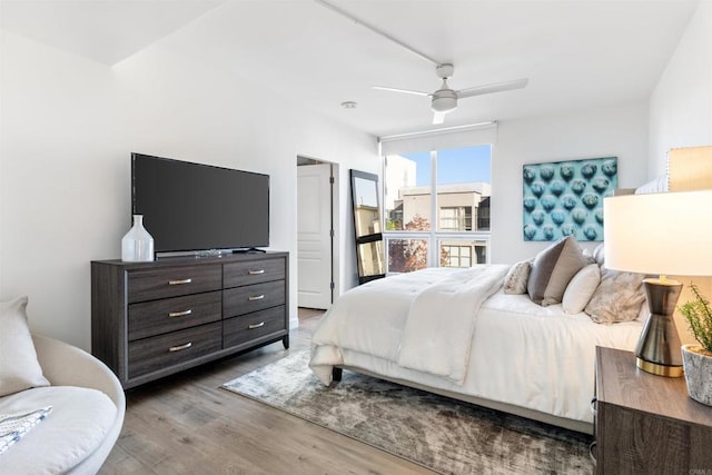 bedroom with ceiling fan and wood-type flooring