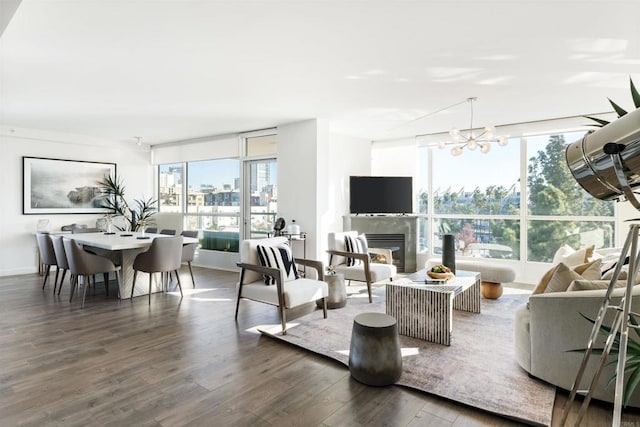 living room with dark hardwood / wood-style flooring and a notable chandelier