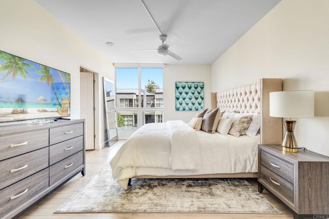 bedroom featuring light wood-type flooring and ceiling fan