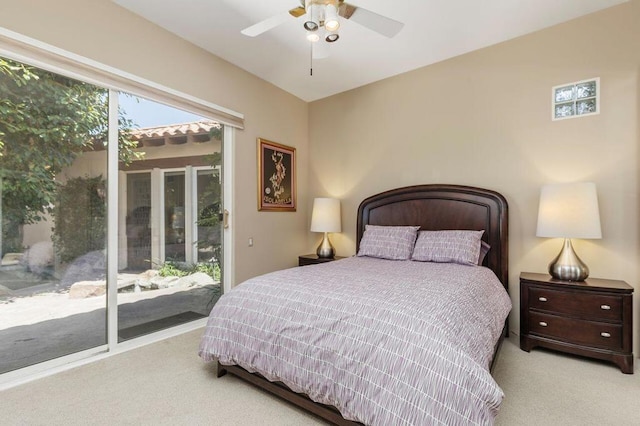 carpeted bedroom with access to exterior and ceiling fan