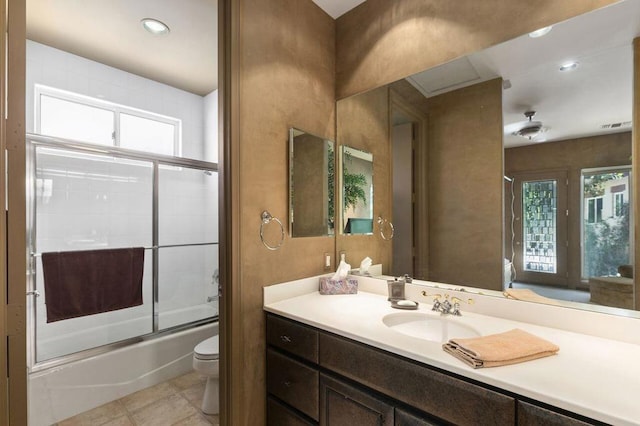 full bathroom with plenty of natural light, toilet, enclosed tub / shower combo, and vanity