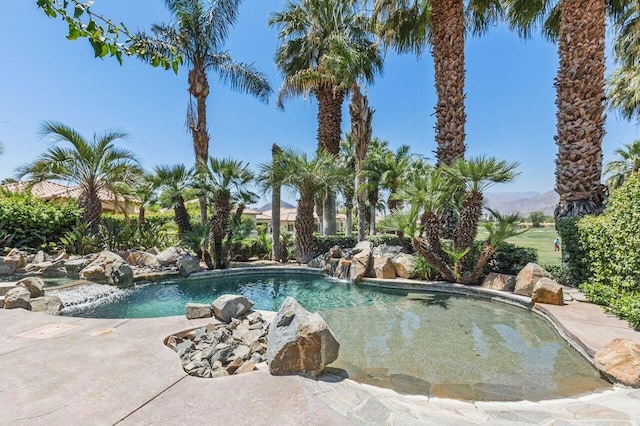 view of swimming pool featuring pool water feature