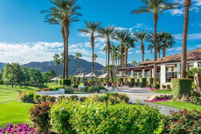 view of home's community featuring a gazebo, a mountain view, and a lawn