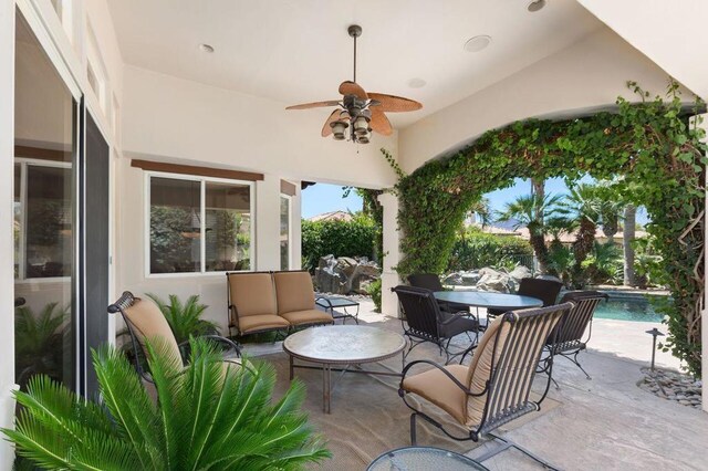 view of patio featuring ceiling fan