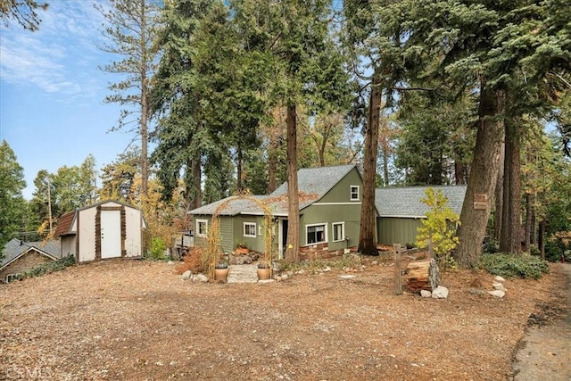 exterior space with a shed