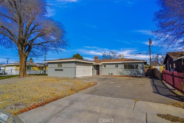 ranch-style home with a garage