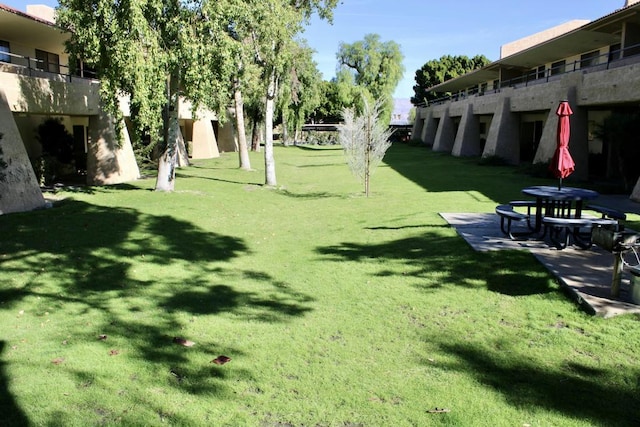 view of community featuring a lawn