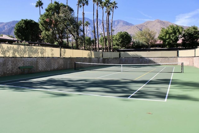 view of sport court with a mountain view