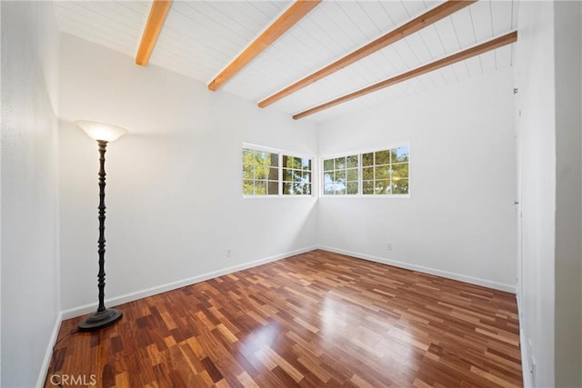 empty room with wood ceiling, beam ceiling, and hardwood / wood-style floors