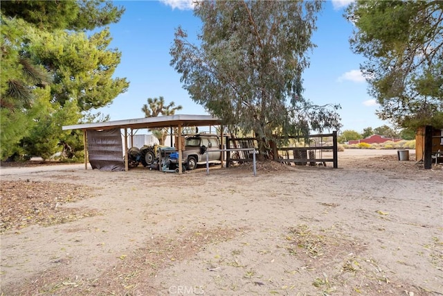 view of outbuilding featuring a carport