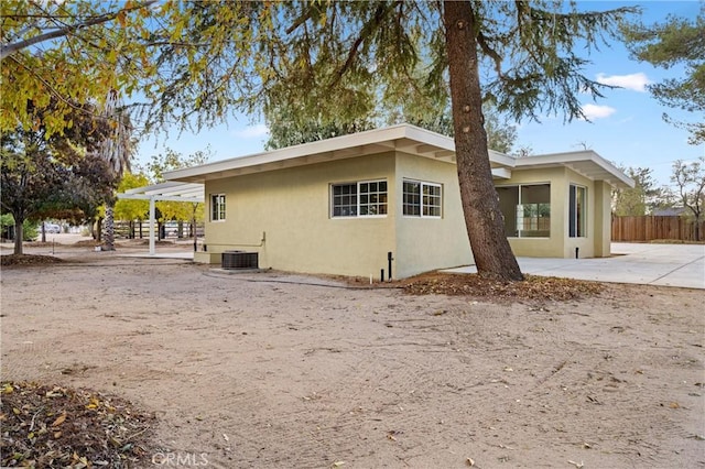 view of home's exterior with central AC