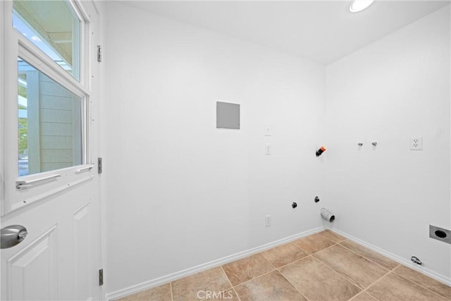 washroom featuring light tile patterned floors, a wealth of natural light, hookup for an electric dryer, and hookup for a gas dryer