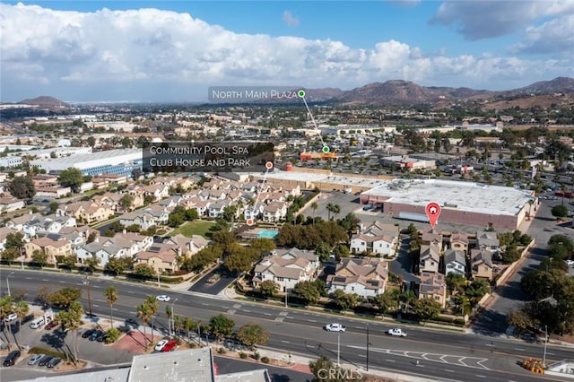 birds eye view of property with a mountain view