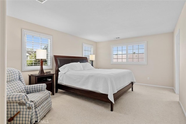 bedroom featuring light colored carpet