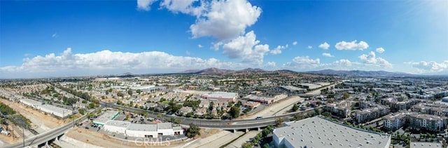 birds eye view of property featuring a mountain view