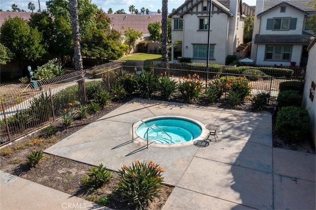 view of pool with a community hot tub and a patio area