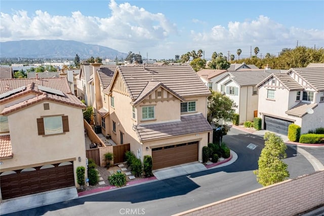 exterior space featuring a mountain view and a garage