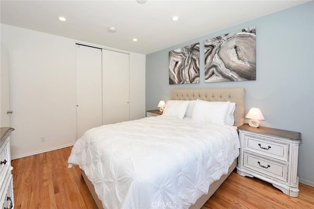 bedroom featuring a closet and light hardwood / wood-style floors