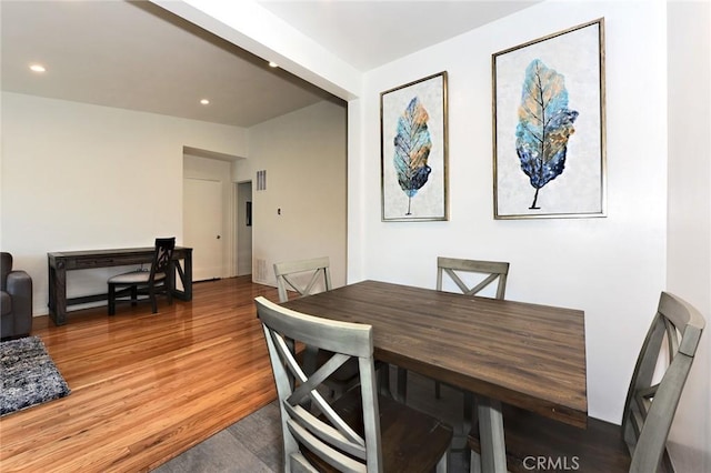 dining area featuring wood-type flooring