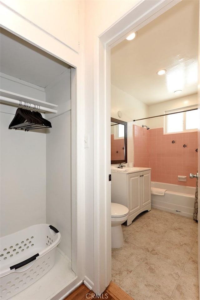 full bathroom featuring toilet, vanity, and shower / bath combo