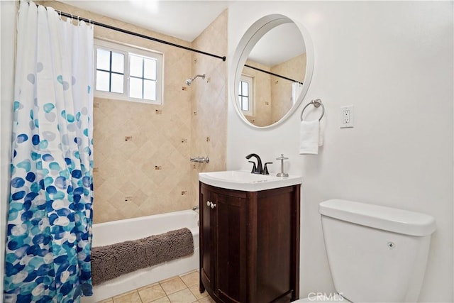 full bathroom featuring tile patterned floors, toilet, vanity, and shower / bathtub combination with curtain