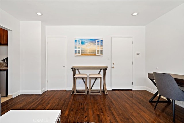 interior space with dark hardwood / wood-style flooring